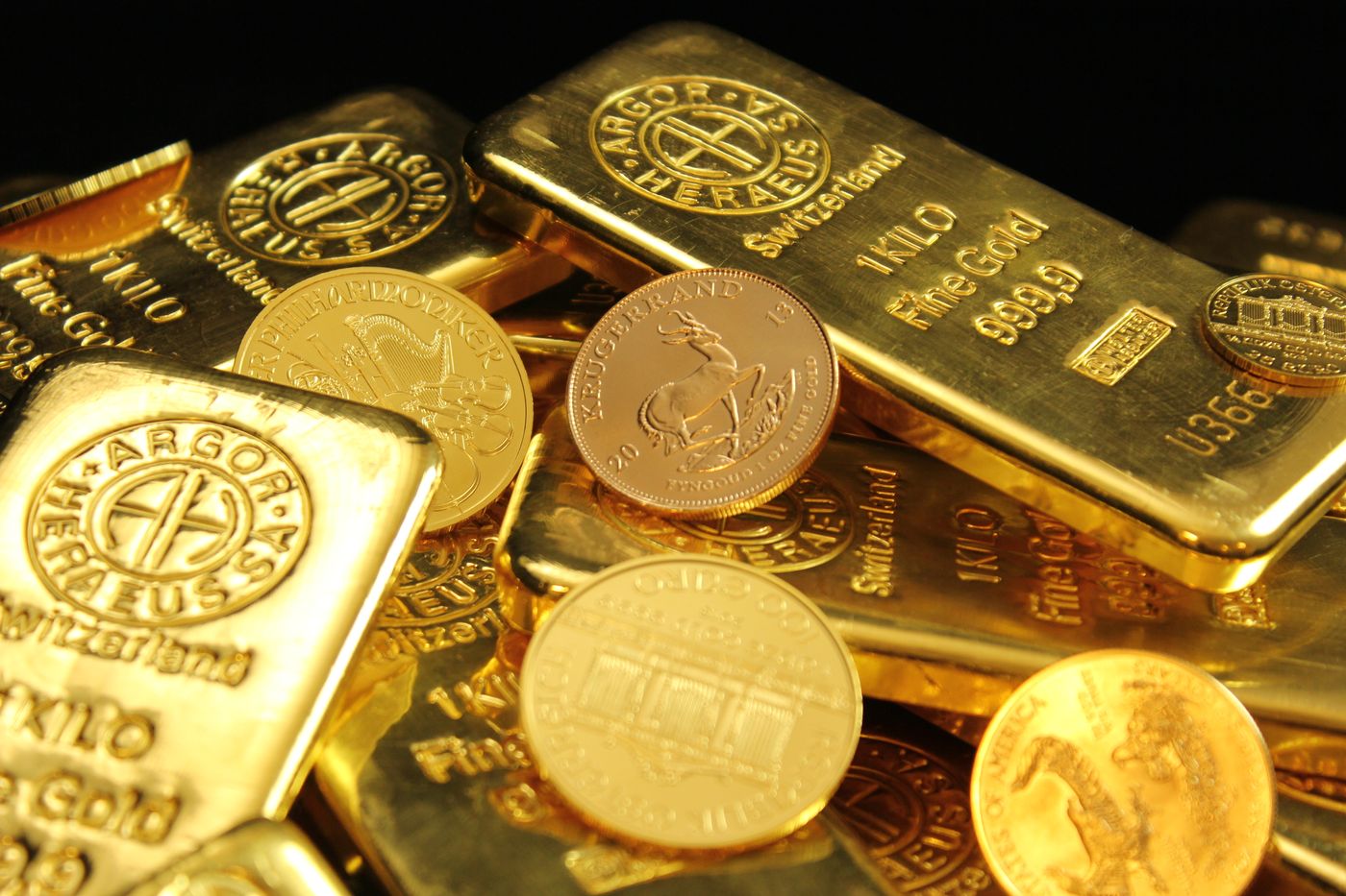 Gold bars and coins representing global markets