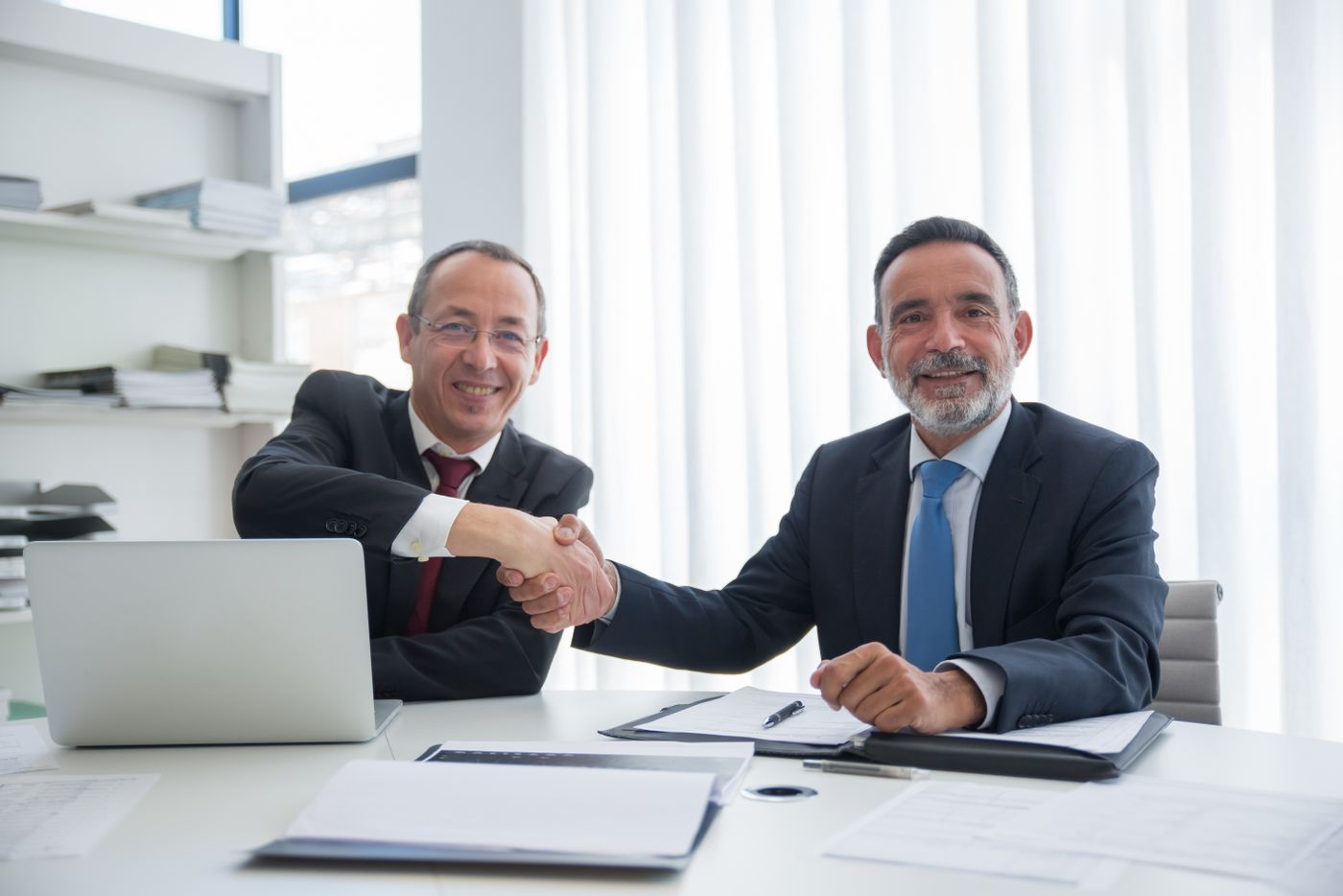 Business partnership handshake